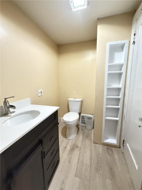 114 W Main St, Sidney, NY 13838 - bathroom with wood finished floors and vanity
