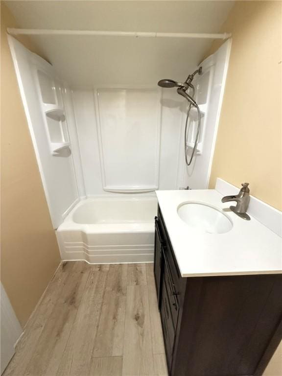 114 W Main St, Sidney, NY 13838 - bathroom featuring wood finished floors, vanity, and shower / bathtub combination