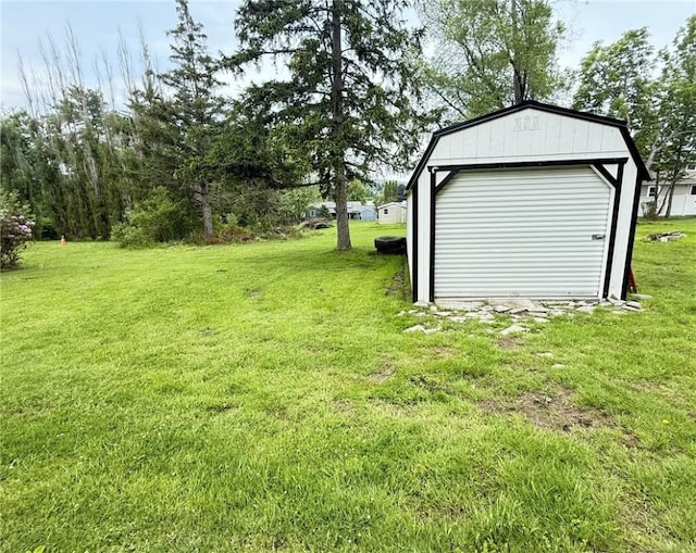 114 W Main St, Sidney, NY 13838 - view of grassy yard with an outbuilding