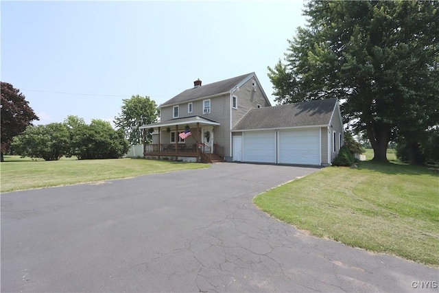 19536 State Route 3, Hounsfield, NY 13601 - view of front of house featuring a porch, a garage, a front yard, driveway, and a chimney