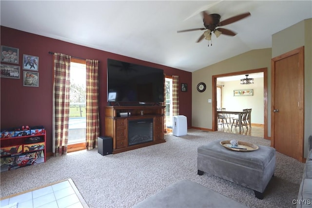 19536 State Route 3, Hounsfield, NY 13601 - carpeted living area with a ceiling fan, vaulted ceiling, and a glass covered fireplace