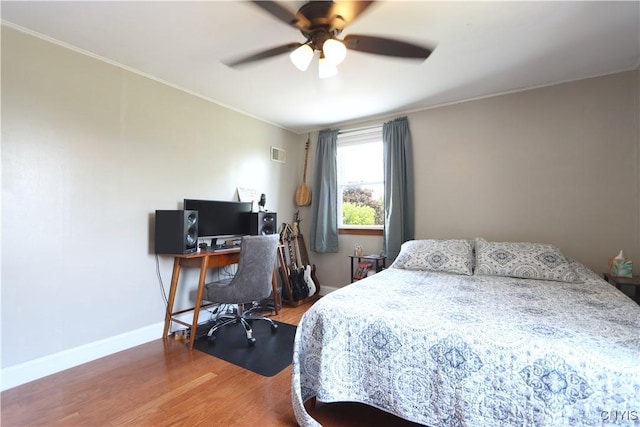 19536 State Route 3, Hounsfield, NY 13601 - bedroom with wood finished floors, ornamental molding, a ceiling fan, and a desk