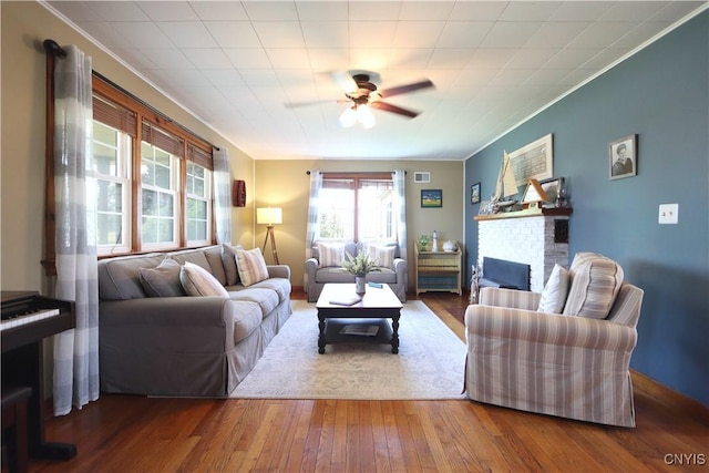 19536 State Route 3, Hounsfield, NY 13601 - living area with a ceiling fan, a fireplace, hardwood / wood-style flooring, and ornamental molding