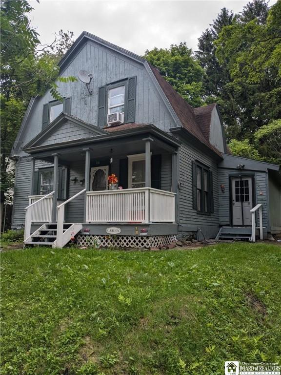 650 Barrows St, Jamestown, NY 14701 - dutch colonial with a porch, a front yard, and cooling unit