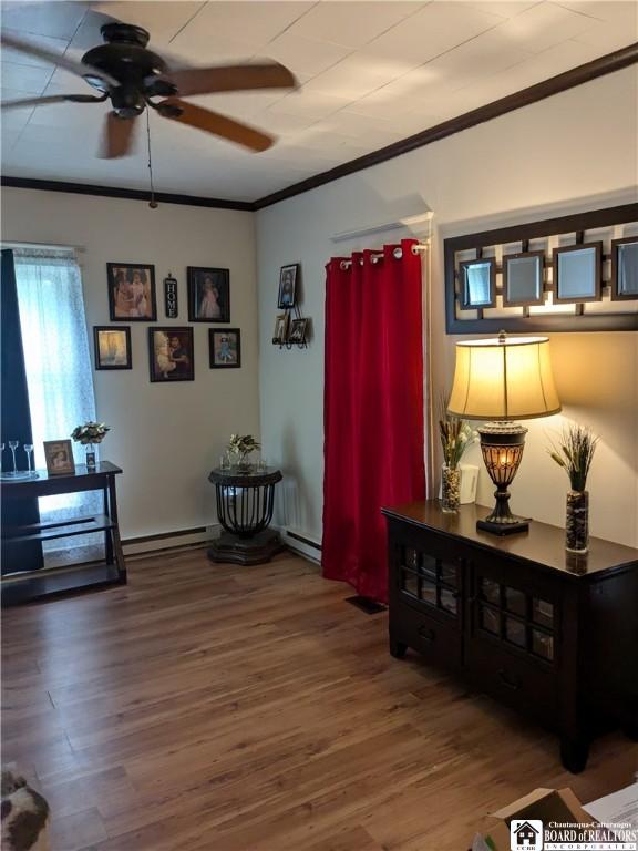 650 Barrows St, Jamestown, NY 14701 - living room featuring a ceiling fan, ornamental molding, and wood finished floors