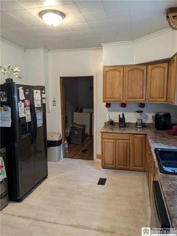 650 Barrows St, Jamestown, NY 14701 - kitchen featuring black fridge with ice dispenser, brown cabinets, dishwashing machine, crown molding, and light wood-style floors