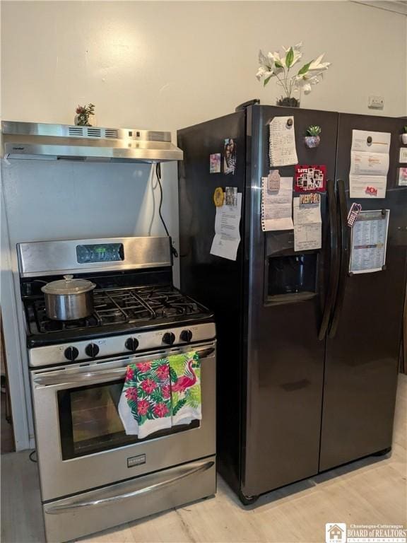 650 Barrows St, Jamestown, NY 14701 - kitchen featuring stainless steel range with gas cooktop, black fridge, and under cabinet range hood