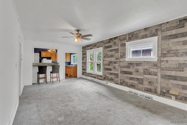 709 87th St, Niagara Falls, NY 14304 - unfurnished living room with carpet flooring and ceiling fan