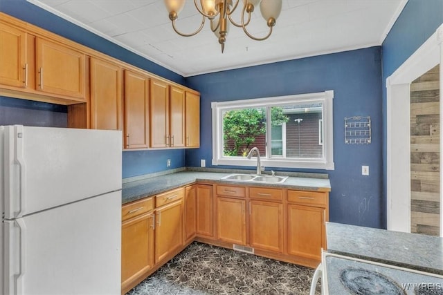 709 87th St, Niagara Falls, NY 14304 - kitchen featuring freestanding refrigerator, a chandelier, and ornamental molding