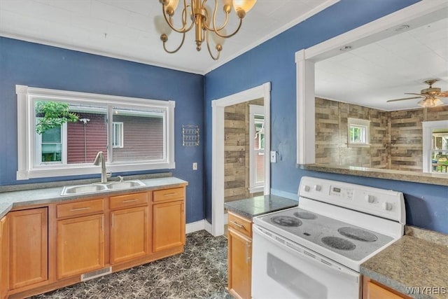 709 87th St, Niagara Falls, NY 14304 - kitchen featuring white range with electric stovetop, ceiling fan, a chandelier, and brown cabinets