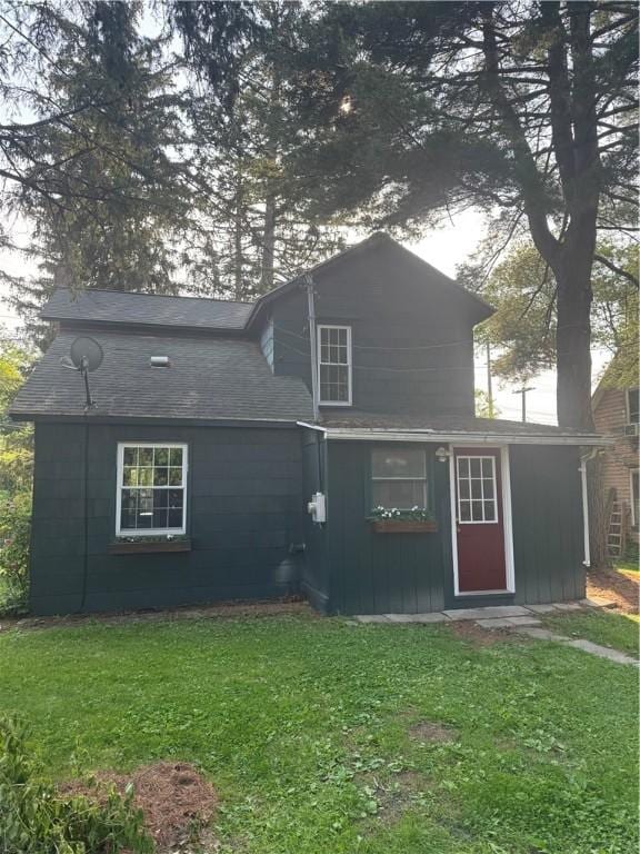 201 Sheppard St, Milo, NY 14527 - rear view of property with a lawn and board and batten siding