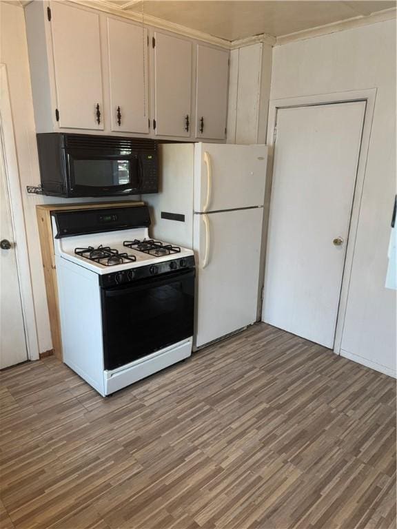 201 Sheppard St, Milo, NY 14527 - kitchen with range with gas cooktop, black microwave, light wood-style flooring, and freestanding refrigerator