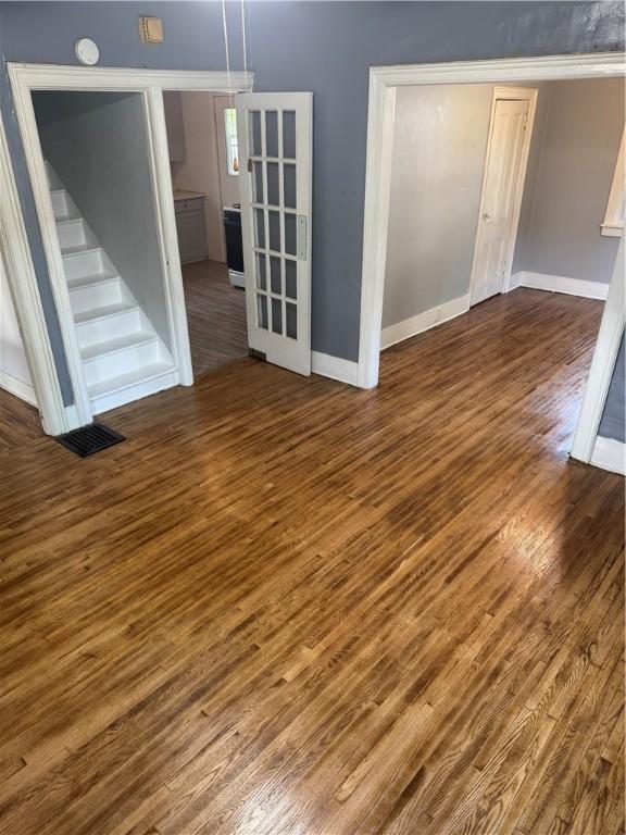 201 Sheppard St, Milo, NY 14527 - empty room with wood finished floors and stairway