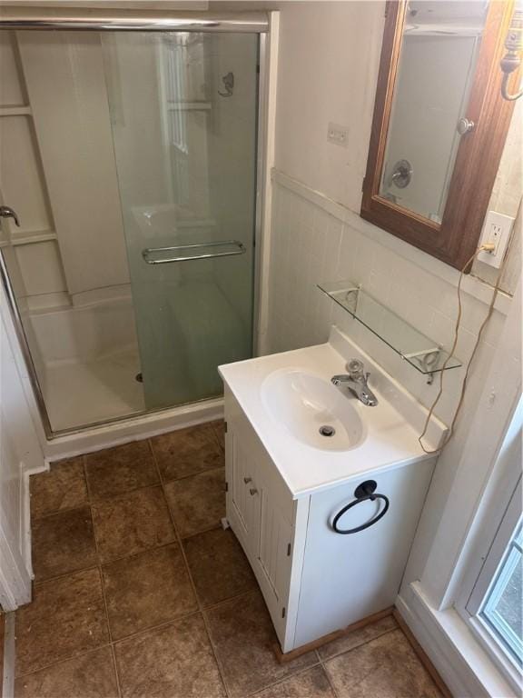 201 Sheppard St, Milo, NY 14527 - bathroom featuring a shower stall, vanity, and a wainscoted wall