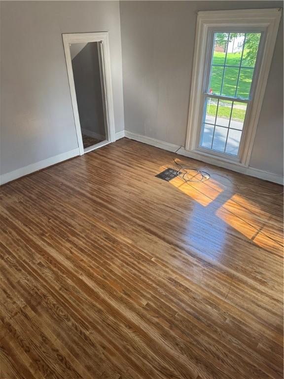 201 Sheppard St, Milo, NY 14527 - empty room with dark wood-style flooring and baseboards