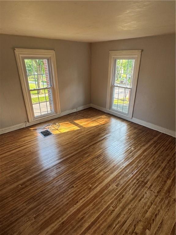 201 Sheppard St, Milo, NY 14527 - empty room with dark wood-type flooring and baseboards