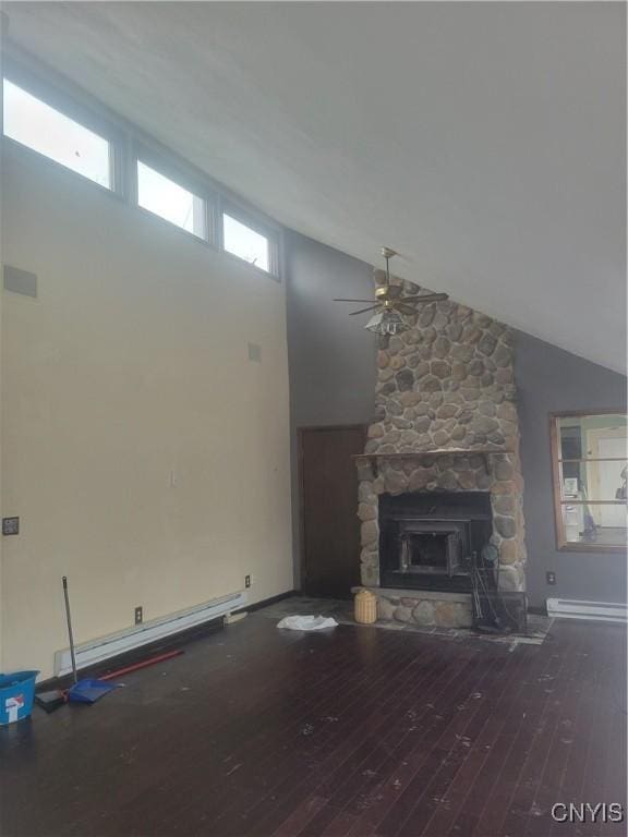 3903 Lafayette Rd, Lafayette, NY 13078 - unfurnished living room featuring ceiling fan, hardwood / wood-style floors, baseboard heating, high vaulted ceiling, and a fireplace