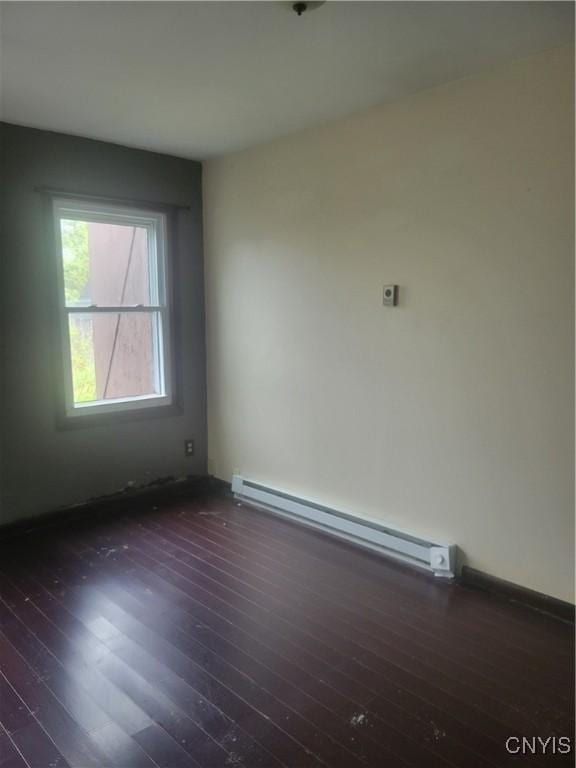 3903 Lafayette Rd, Lafayette, NY 13078 - spare room featuring baseboard heating and dark wood-style floors