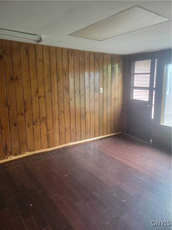 3903 Lafayette Rd, Lafayette, NY 13078 - spare room featuring hardwood / wood-style floors and wooden walls