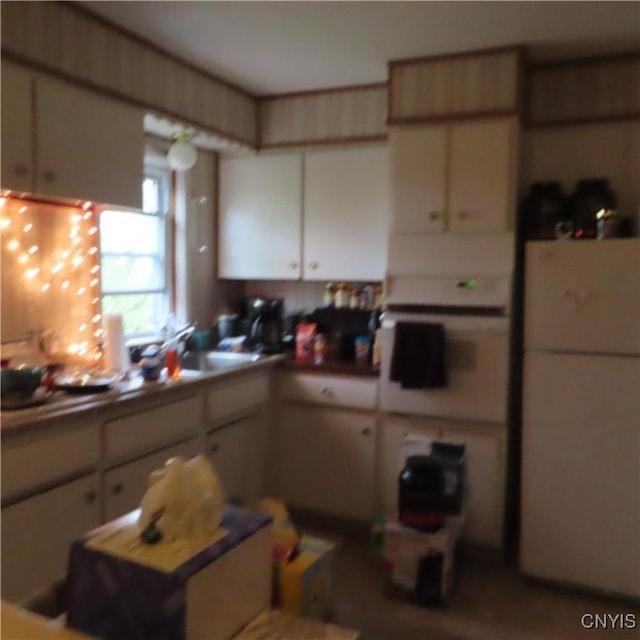 3903 Lafayette Rd, Lafayette, NY 13078 - kitchen featuring freestanding refrigerator and white cabinets