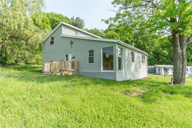 46946 Dingman Point Rd, Alexandria, NY 13607 - back of property with a deck