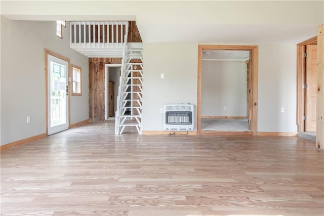 46946 Dingman Point Rd, Alexandria, NY 13607 - unfurnished living room featuring heating unit and wood finished floors