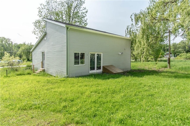 46946 Dingman Point Rd, Alexandria, NY 13607 - rear view of property featuring a yard and entry steps