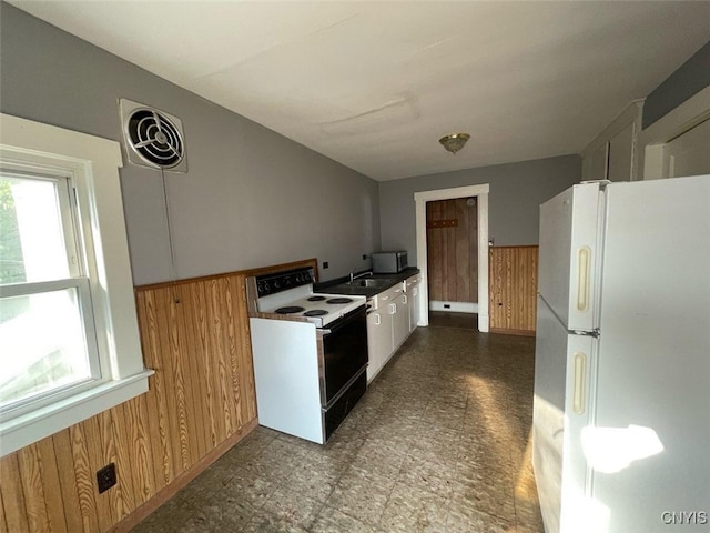 551/2 N Helmer Ave, Manheim, NY 13329 - kitchen featuring freestanding refrigerator, electric stove, and wooden walls