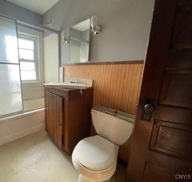 551/2 N Helmer Ave, Manheim, NY 13329 - full bath with vanity, a wainscoted wall, shower / tub combination, and wooden walls