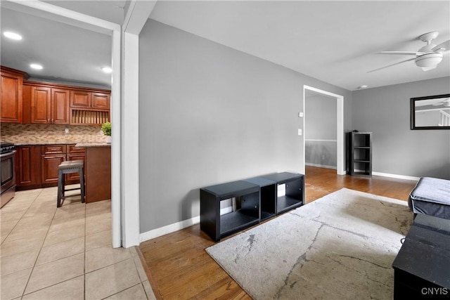 7698 Anchor Dr, Clay, NY 13090 - living area with ceiling fan, recessed lighting, and light tile patterned floors