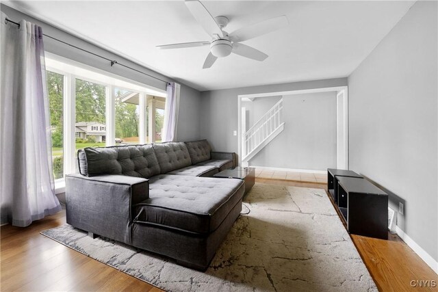 7698 Anchor Dr, Clay, NY 13090 - living room featuring healthy amount of natural light, wood finished floors, and ceiling fan