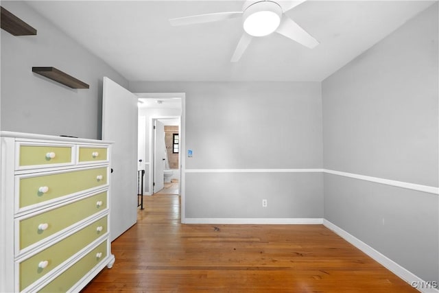 7698 Anchor Dr, Clay, NY 13090 - unfurnished bedroom featuring wood finished floors and ceiling fan