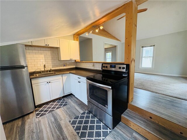 216 W William St Unit 201, Corning-City, NY 14830 - kitchen with appliances with stainless steel finishes, dark countertops, white cabinets, and dark wood-type flooring