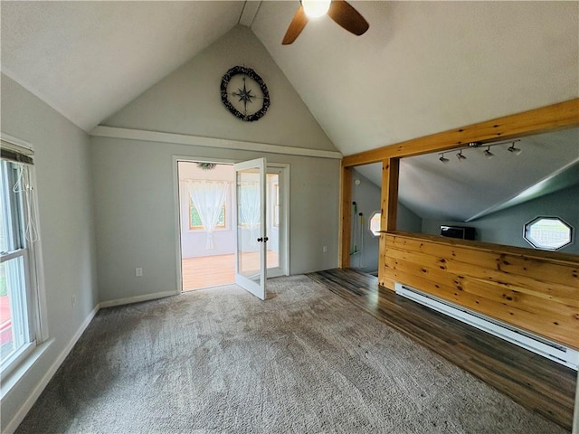 216 W William St Unit 201, Corning-City, NY 14830 - unfurnished living room with ceiling fan, baseboard heating, french doors, rail lighting, and high vaulted ceiling