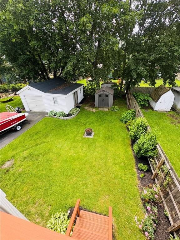 216 W William St Unit 201, Corning-City, NY 14830 - fenced backyard featuring a shed and a garage