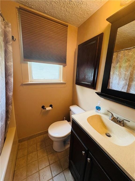 216 W William St Unit 201, Corning-City, NY 14830 - bathroom with a textured ceiling, vanity, and tile patterned floors