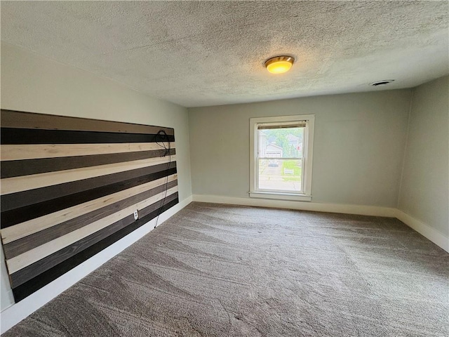 216 W William St Unit 201, Corning-City, NY 14830 - spare room featuring carpet floors and a textured ceiling