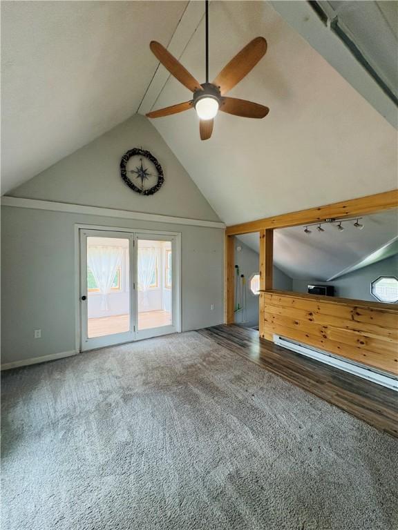 216 W William St Unit 201, Corning-City, NY 14830 - unfurnished living room with lofted ceiling, ceiling fan, and wood finished floors