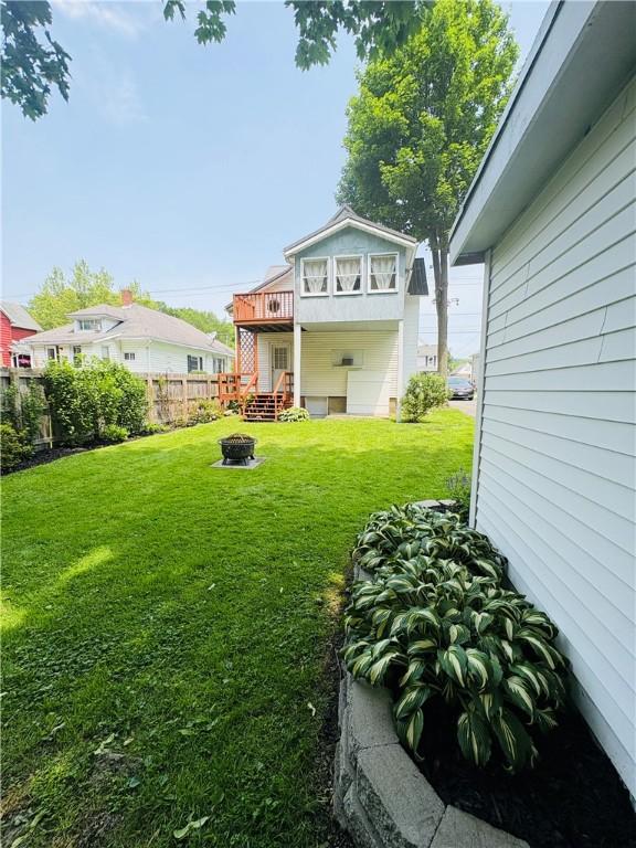 216 W William St Unit 201, Corning-City, NY 14830 - view of yard featuring a wooden deck and an outdoor fire pit