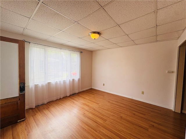 216 W William St Unit 201, Corning-City, NY 14830 - unfurnished room featuring a paneled ceiling and light wood-type flooring