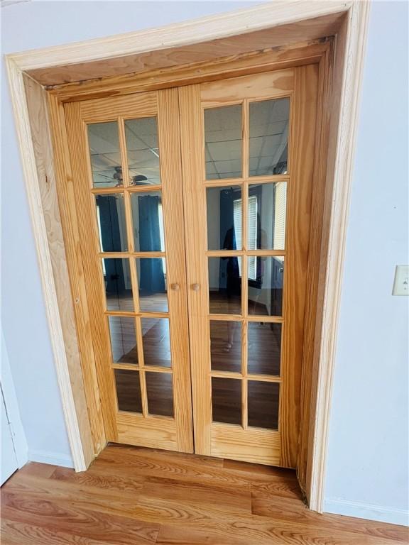 216 W William St Unit 201, Corning-City, NY 14830 - detailed view of wood finished floors and baseboards