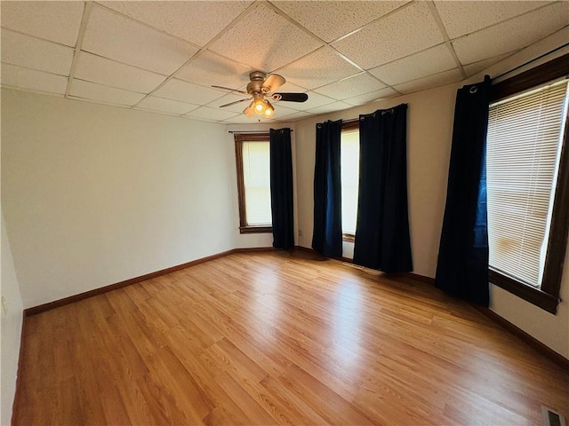 216 W William St Unit 201, Corning-City, NY 14830 - spare room featuring a paneled ceiling, ceiling fan, and light wood finished floors