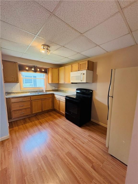 216 W William St Unit 201, Corning-City, NY 14830 - kitchen featuring white appliances, a drop ceiling, light wood finished floors, and light countertops