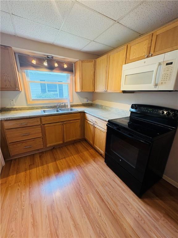 216 W William St Unit 201, Corning-City, NY 14830 - kitchen featuring white microwave, electric range, light countertops, light wood-style flooring, and a paneled ceiling