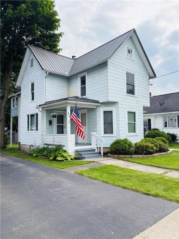 216 W William St Unit 201, Corning-City, NY 14830 - view of front of house with a standing seam roof, covered porch, and a metal roof