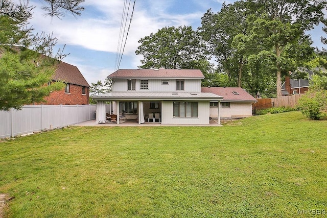 425 Vanderbilt Ave, Niagara Falls, NY 14305 - rear view of property with a patio area and a fenced backyard