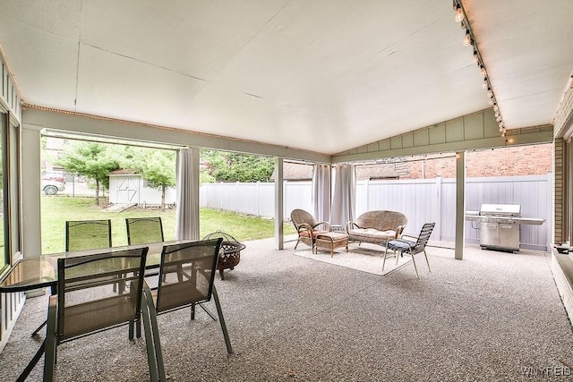 425 Vanderbilt Ave, Niagara Falls, NY 14305 - sunroom featuring outdoor dining area, track lighting, and lofted ceiling