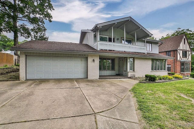 425 Vanderbilt Ave, Niagara Falls, NY 14305 - view of front of home featuring brick siding, a balcony, board and batten siding, and concrete driveway