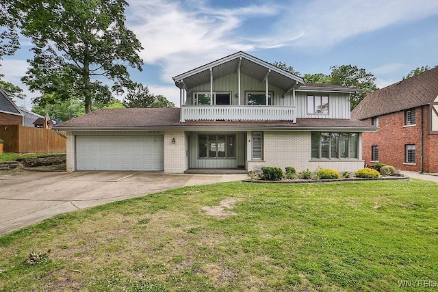 425 Vanderbilt Ave, Niagara Falls, NY 14305 - view of front of home with a balcony, a garage, board and batten siding, driveway, and brick siding