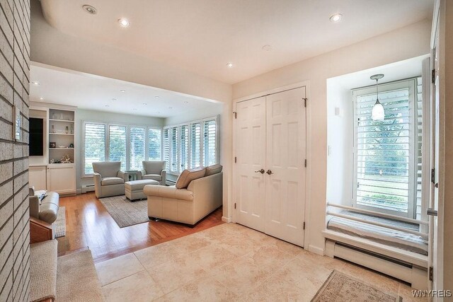 425 Vanderbilt Ave, Niagara Falls, NY 14305 - entrance foyer featuring a baseboard heating unit, recessed lighting, and wood finished floors